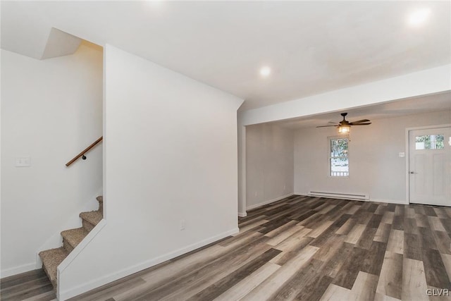 foyer entrance with dark wood-type flooring and baseboard heating