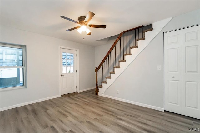 entryway featuring wood-type flooring and ceiling fan