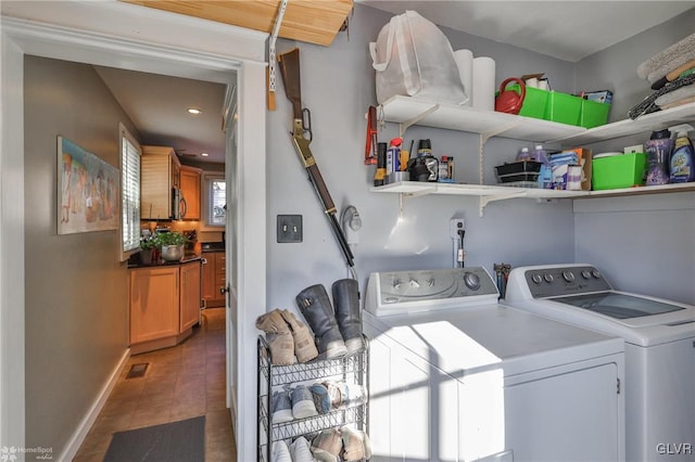 washroom featuring dark wood-type flooring and washer and clothes dryer