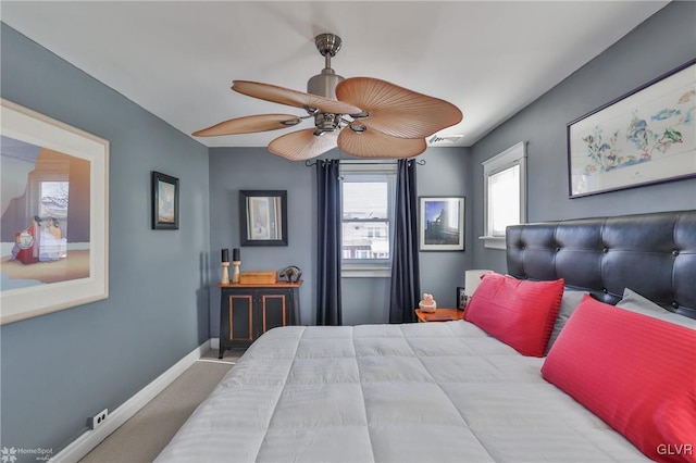 carpeted bedroom featuring ceiling fan