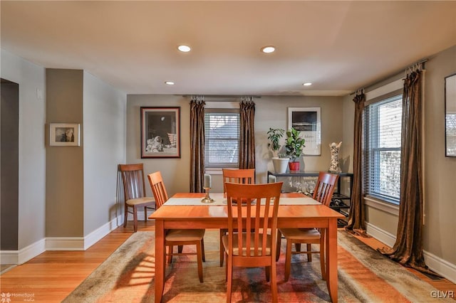 dining space with light hardwood / wood-style floors