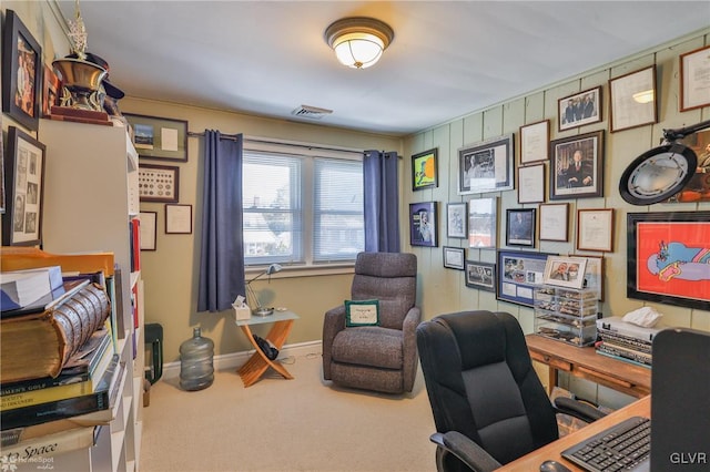 office area with wooden walls and carpet