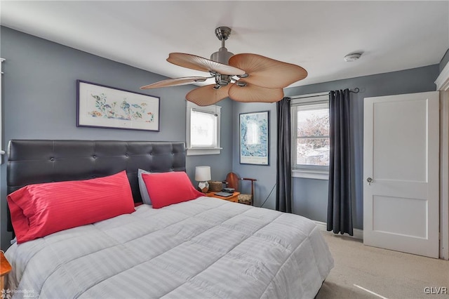 carpeted bedroom featuring ceiling fan