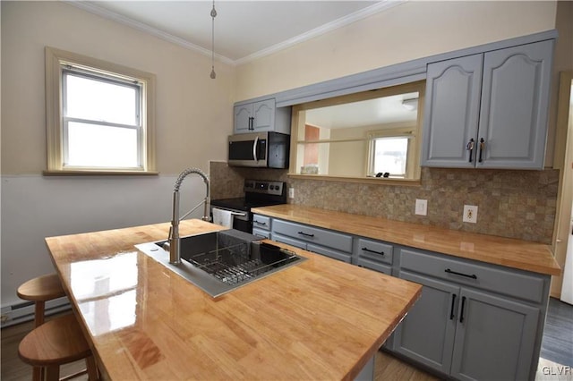 kitchen featuring gray cabinets, appliances with stainless steel finishes, sink, and decorative backsplash