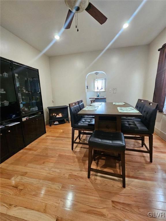 dining area with ceiling fan and light wood-type flooring