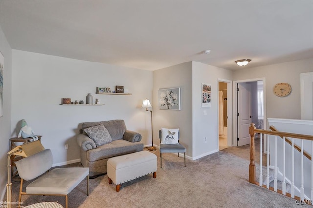 living area featuring light carpet