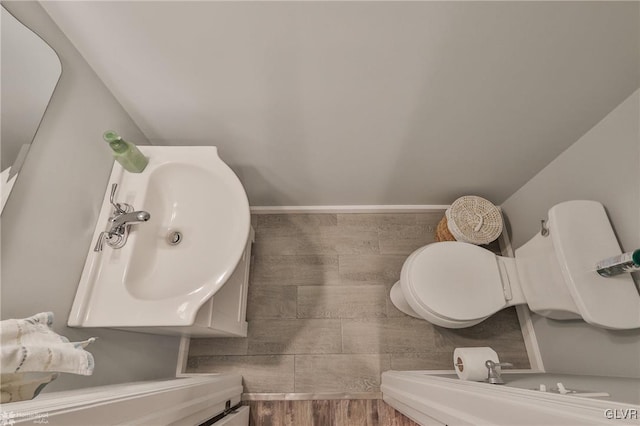 bathroom featuring toilet and sink