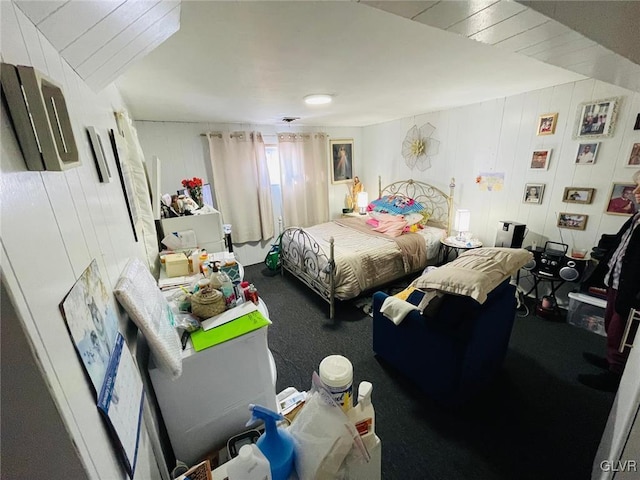 bedroom with wooden walls