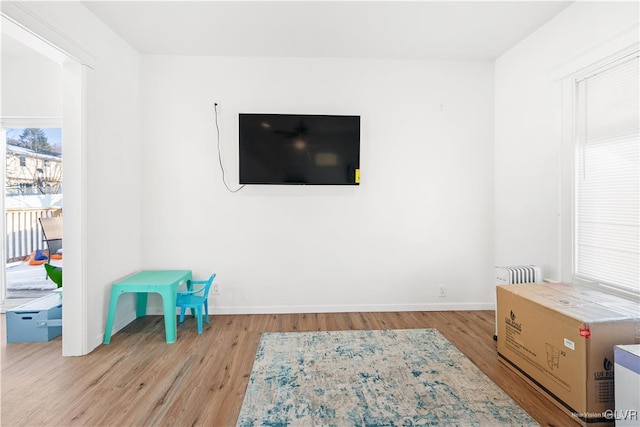 game room with light wood-type flooring