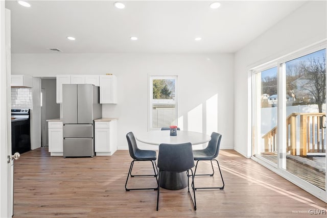 dining area featuring light wood-type flooring