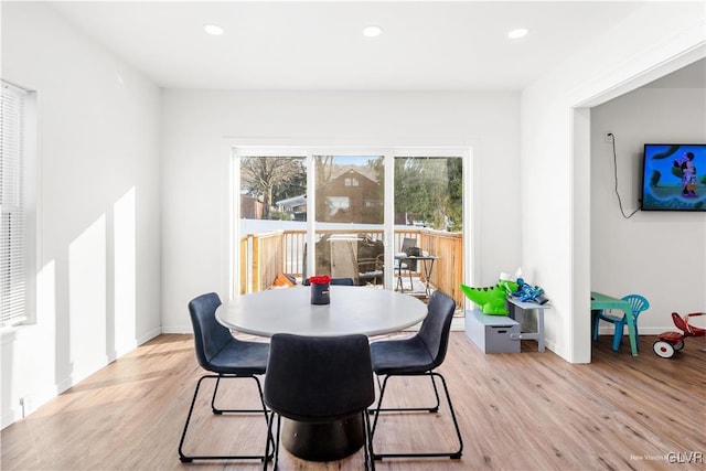 dining space with light hardwood / wood-style flooring