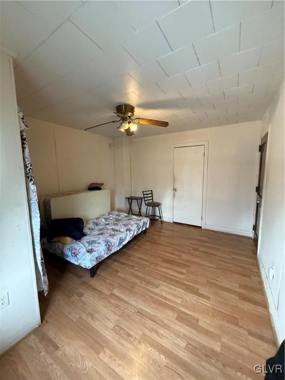 bedroom featuring ceiling fan and light wood-type flooring