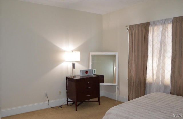 bedroom featuring light colored carpet