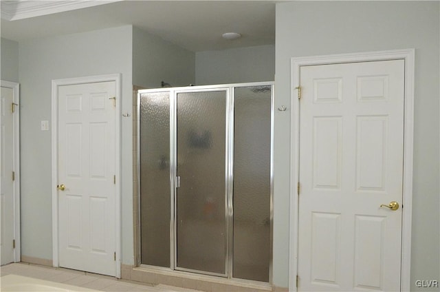 bathroom featuring tile patterned floors and walk in shower