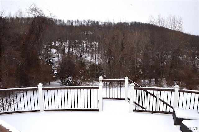 view of snow covered deck