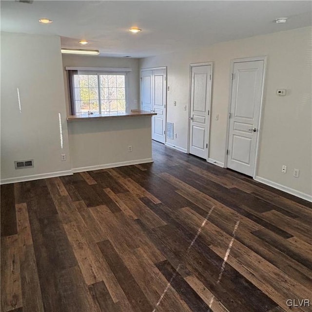 spare room featuring dark hardwood / wood-style flooring