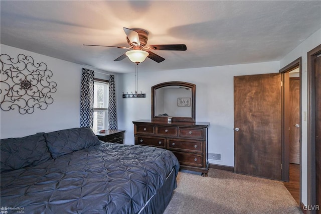 carpeted bedroom with ceiling fan