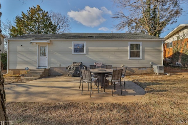 rear view of property featuring a patio area and central air condition unit