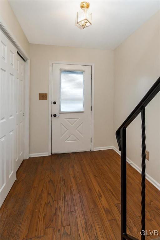 foyer entrance with dark hardwood / wood-style flooring