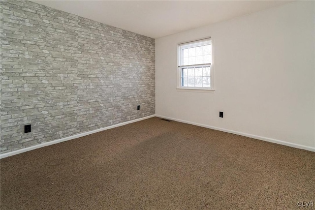 spare room featuring carpet