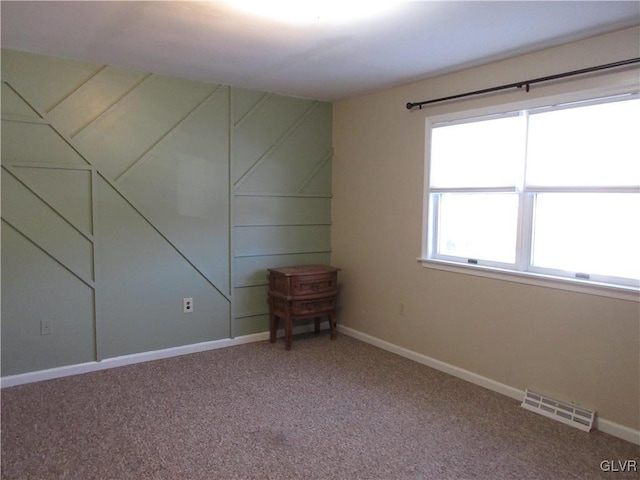 spare room with carpet floors