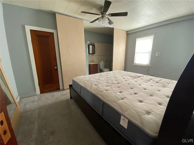 bedroom with connected bathroom and ceiling fan