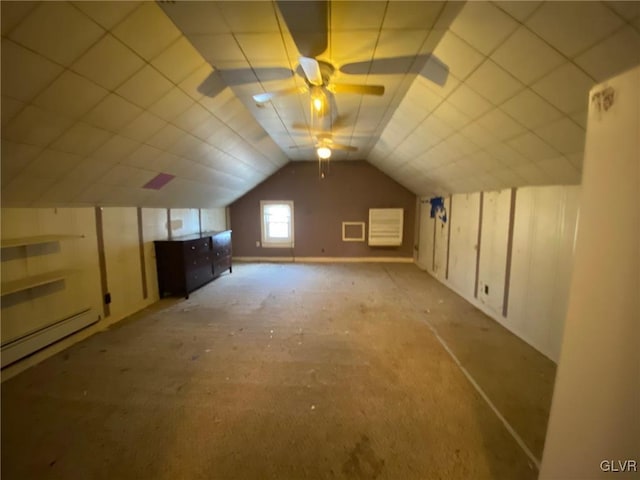 bonus room featuring ceiling fan, vaulted ceiling, and a baseboard heating unit