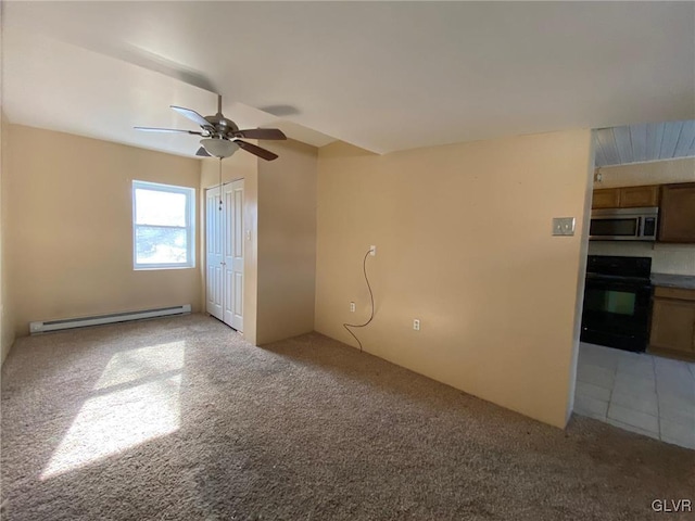 unfurnished room featuring a baseboard radiator, light carpet, and ceiling fan