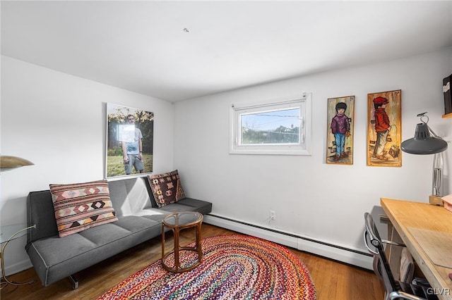 sitting room featuring dark wood-type flooring and a baseboard radiator