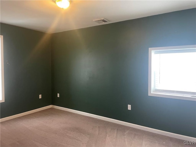 spare room featuring carpet floors