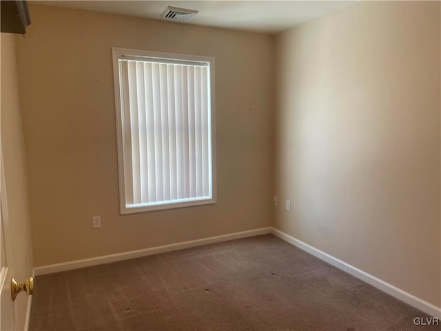 empty room featuring carpet floors