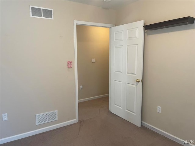 unfurnished bedroom with carpet flooring