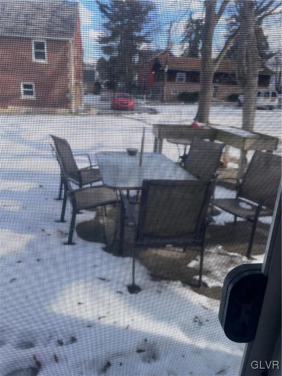 snow covered patio featuring central air condition unit