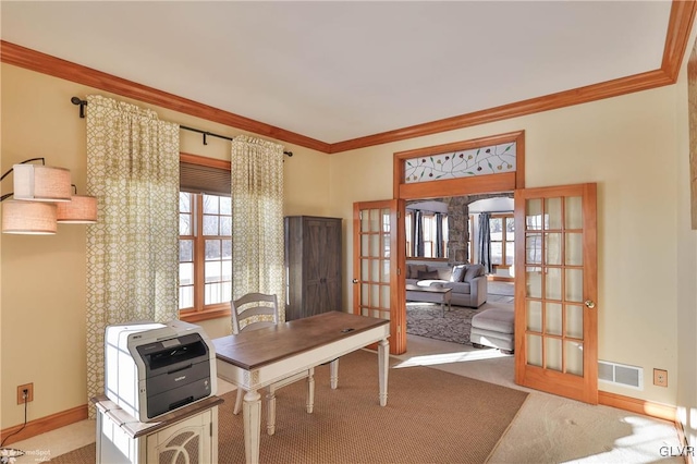 home office with french doors, ornamental molding, and carpet flooring