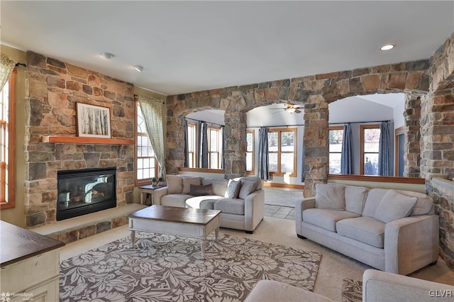 carpeted living room with a fireplace