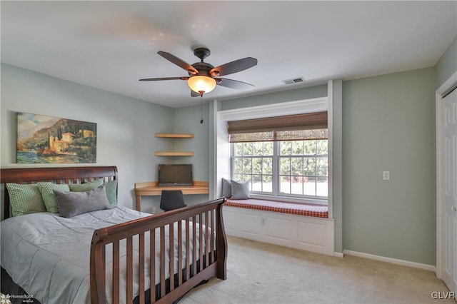 carpeted bedroom featuring ceiling fan