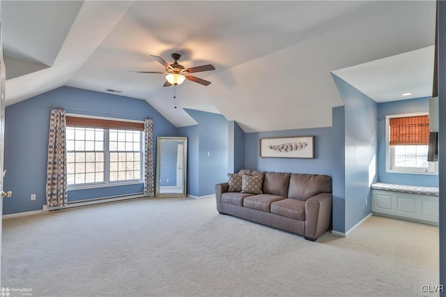 living room featuring light carpet, vaulted ceiling, and ceiling fan