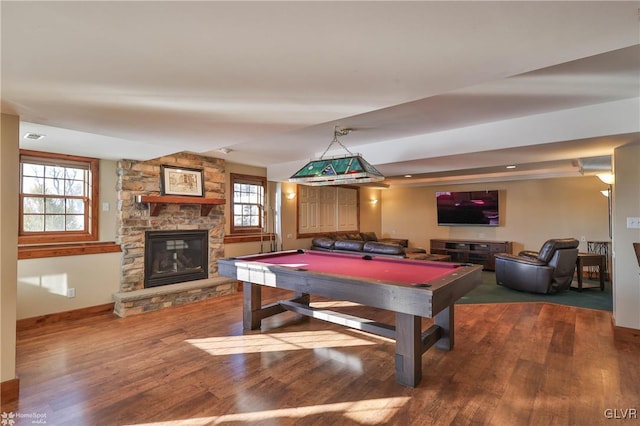 game room with hardwood / wood-style floors, pool table, and a fireplace