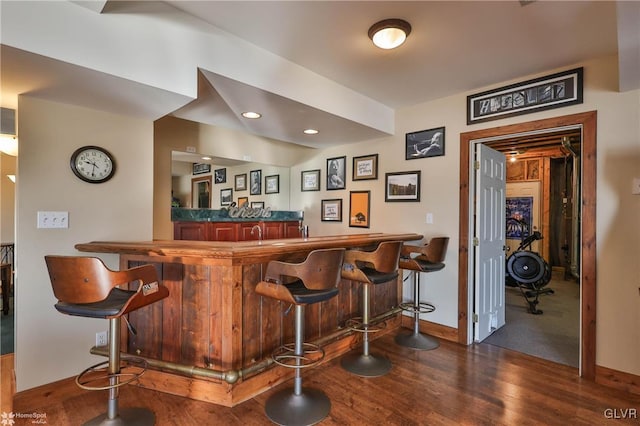 bar featuring dark hardwood / wood-style floors