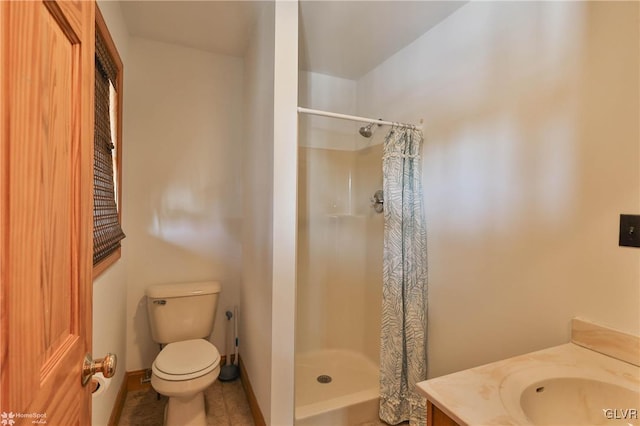 bathroom with vanity, a shower with curtain, and toilet