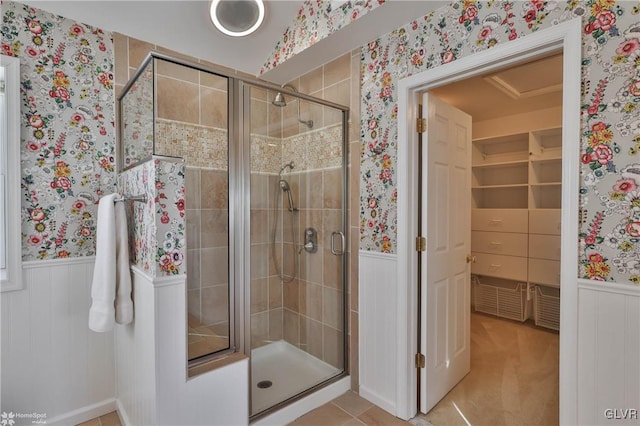 bathroom with a shower with shower door