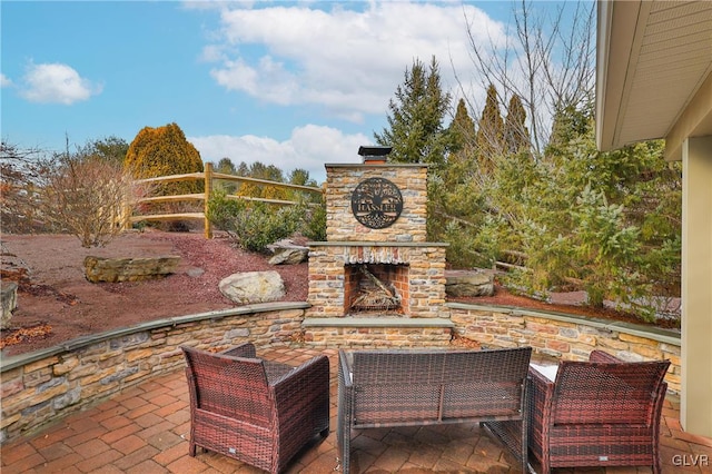 view of patio with an outdoor stone fireplace