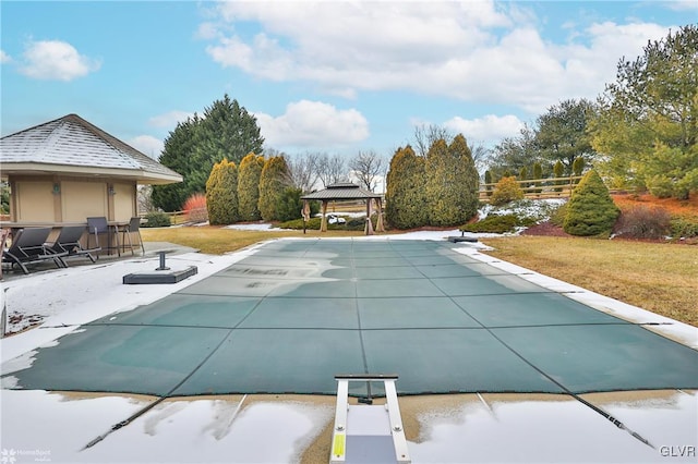 view of swimming pool with a yard and a gazebo