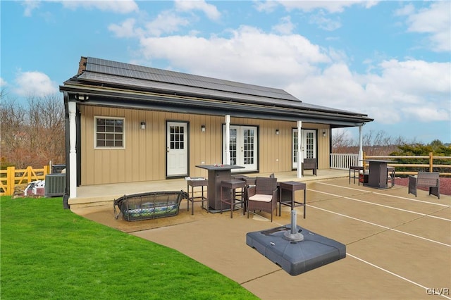 back of house with french doors, central AC unit, and a patio area