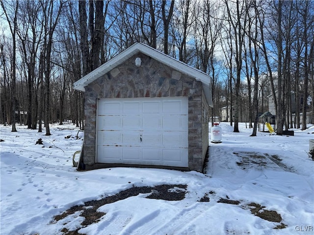 view of snow covered garage