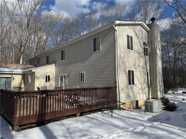 snow covered property featuring a deck