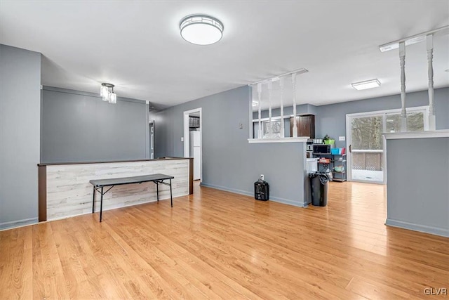 unfurnished living room with light hardwood / wood-style floors