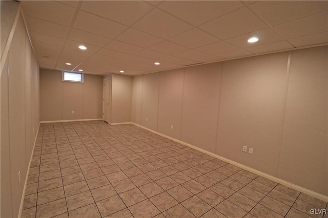 basement featuring a drop ceiling