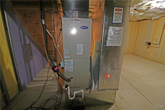 utility room featuring heating unit