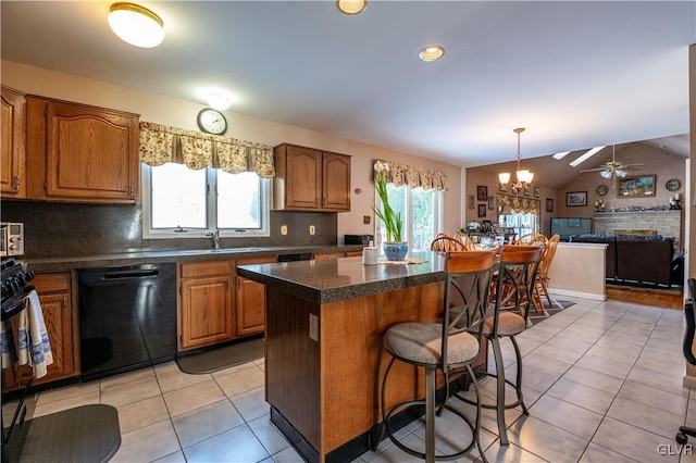 kitchen with light tile patterned flooring, a kitchen bar, tasteful backsplash, a center island, and dishwasher